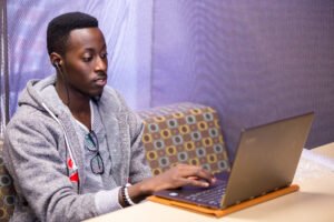 첥ӰMaster of Science in Information Science student working on his laptop